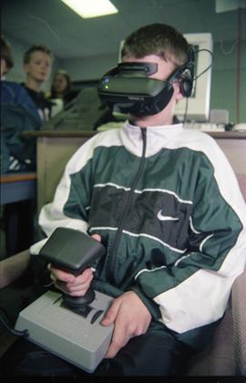 Open House 1998; boy using VR headset and joystick