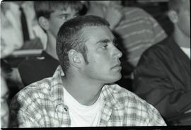 Communications Relations Opening Day 1991; closeup of student listening with raised chin