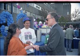 Open House 1992; group of three talking with piece of cake in woman's hand