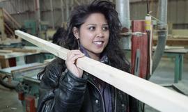 BCIT Women in Trades; carpentry, woman carrying a piece of wood [5 of 5 photographs]