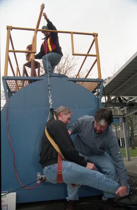 Open House 1998; three men using a pulley harness