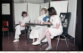 Open House 1986; students with dummy dressed as nurse; right angle