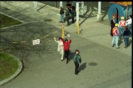 Open House 1998; two women waving up to camera from below