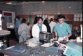 Open House 1986; people examining medical equipment on display