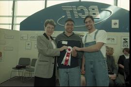 Open House 1998; two students standing with woman in suit holding 2nd prize ribbon [photograph 1 ...