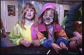 Open house 1992; two girls with face paint smile at camera [photograph 1 of 2]