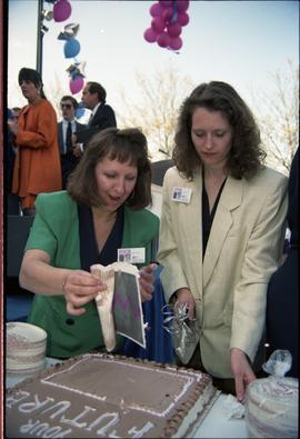 Open House 1992; two women preparing to cut into cake