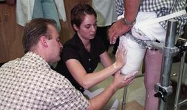 Cast being made of residual limb [1 of 3 photographs]