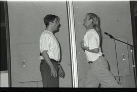 Communications Relations Opening Day 1991; two men in orientation t-shirts improving