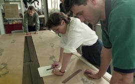 People measuring ink footprints [5 of 10 photographs]
