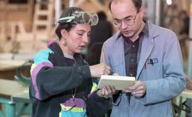 BCIT Women in Trades; carpentry, two people marking and measuring a piece of wood [6 of 6 photogr...