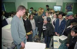 Open House 1998; young students examining computer and technology displays
