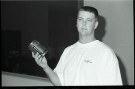 Communications Relations Opening Day 1991; man with orientation shirt holding a BCIT travel mug