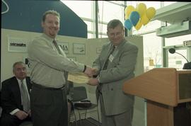 Open House 1998; student shaking hands with man in suit for award for Best Environmental Project