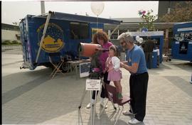 Open house 1992; child being helped with using  Schmidt–Cassegrain telescope
