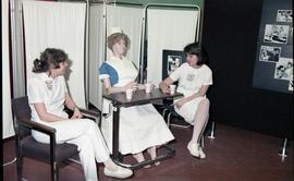 Open House 1986; students with dummy dressed as nurse