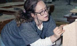 BCIT Women in Trades Training; carpentry, woman marking wood [1 of 3 photographs]