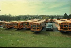 Open House 1998; school buses and truck in parking lot surrounded by grass
