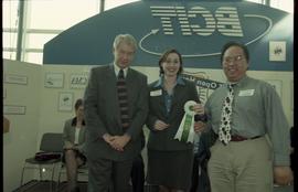 Open House 1998; two people stand with honorable mention ribbon with man in suit [photograph 2 of 3]