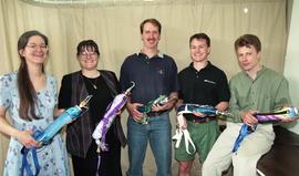 Prosthetics/Orthotics student group photo, posing with prosthetics [2 of 4 photographs]