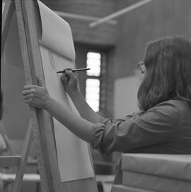 BC Vocational School Fine Arts ; a student pencil drawing a sketch of a model