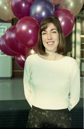 Open house 1995; woman  smiling in front of balloons [photograph 2 of 4]