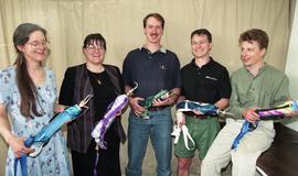 Prosthetics/Orthotics student group photo, posing with prosthetics [4 of 4 photographs]
