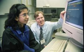 Open House 1998; man watching girl use computer [photograph 3 of 3]