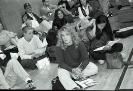 Communications Relations Opening Day 1991; women sitting on the ground with group and papers