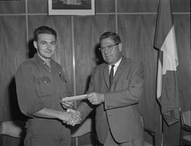 Welding, 1967; Presentation to top welding students; student smiling and receiving a cheque