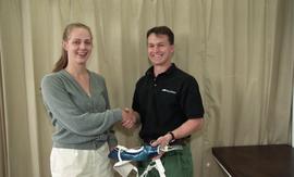 Pair of students posing with prosthetics [2 of 5 photographs]