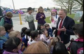 Open house 1992; man on knees speaking to school children [photograph 3 of 5]
