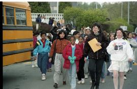 Open house 1992; teacher leading school children beside school bus [photograph 1 of 3]