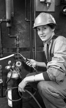 BCIT Women in Trades; plumbing, Megan with welding torch, February 1994 [2 of 5 photographs]