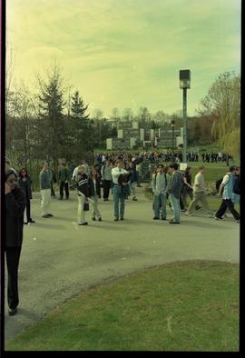 Open House 1998; possible students walking on concrete pathways with trees in background