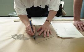 People measuring ink footprints [4 of 10 photographs]