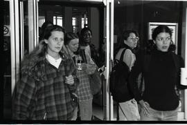 Communications Relations Opening Day 1991; group of women walking through glass doors