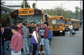 Open house 1992; close up of students milling in front of school buses