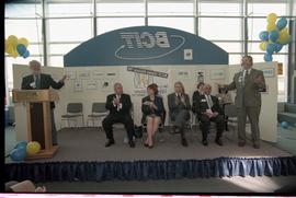 Open House 1998; two men gesturing to each other across from Open House BCIT stage