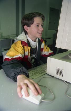 Open House 1998; boy staring up at computer [photograph 1 of 2]