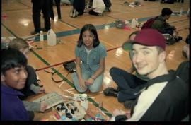 Open House 1998; preteen group on gym floor smiling at camera