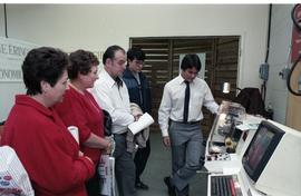 Open House 1986; group viewing CND printing machine [photograph 2 of 2]