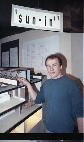 Open House 1992; man pointing at architecture model  [photograph 2 of 3]
