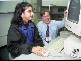Open House 1998; man watching girl use computer [photograph 1 of 3]