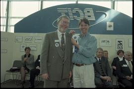 Open House 1998; student grinning with bearded man in suit holding first prize ribbon [photograph...