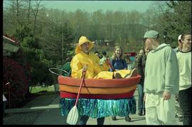 Open House 1998; man in raincoat and boat costume interacting with passerby [photograph 2 of 2]