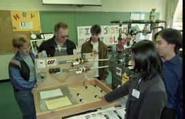 Open House 1998; students gathered around man and Western Supplies thermostat display [photograph...