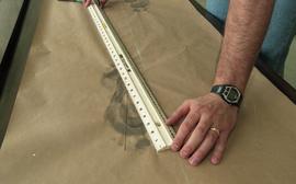 People measuring ink footprints [10 of 10 photographs]
