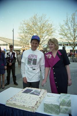 Open House 1992; man and woman cutting cake [photograph 1 of 2]