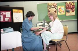 Open House 1986; woman taking blood pressure